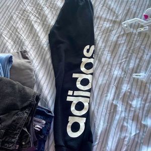 black adidas sweatpants, soft inside, says adidas on the side leg